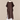A dark brown linen tunic with short wide sleeves and subtle contrast stitching on the cuffs and neckline, displayed on a mannequin over white pants against a neutral beige textured backdrop.