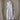 A light lavender-gray long-sleeve button-front tunic dress displayed on a mannequin torso against a soft beige curtain backdrop.